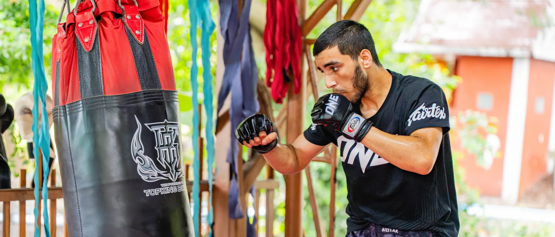 Heavy bag training at Kiatphontip Muay Thai camp, Bangkok