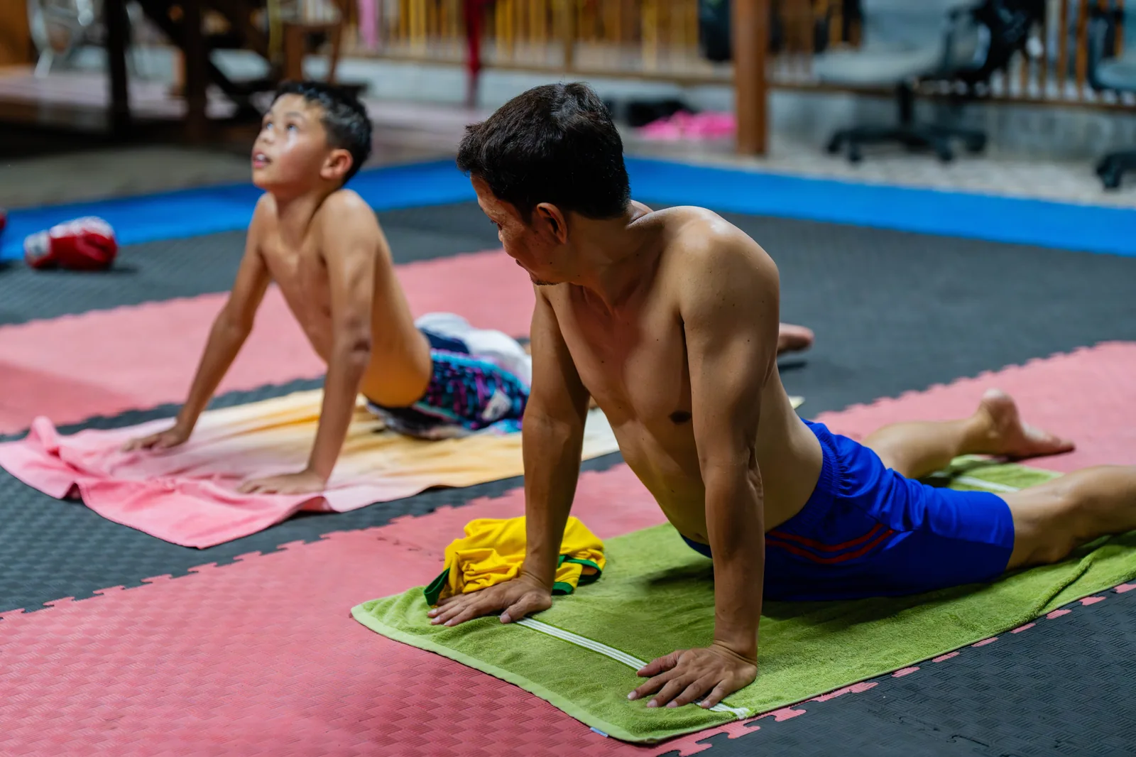 Students stretching on the mats after the morning session at Kiatphontip