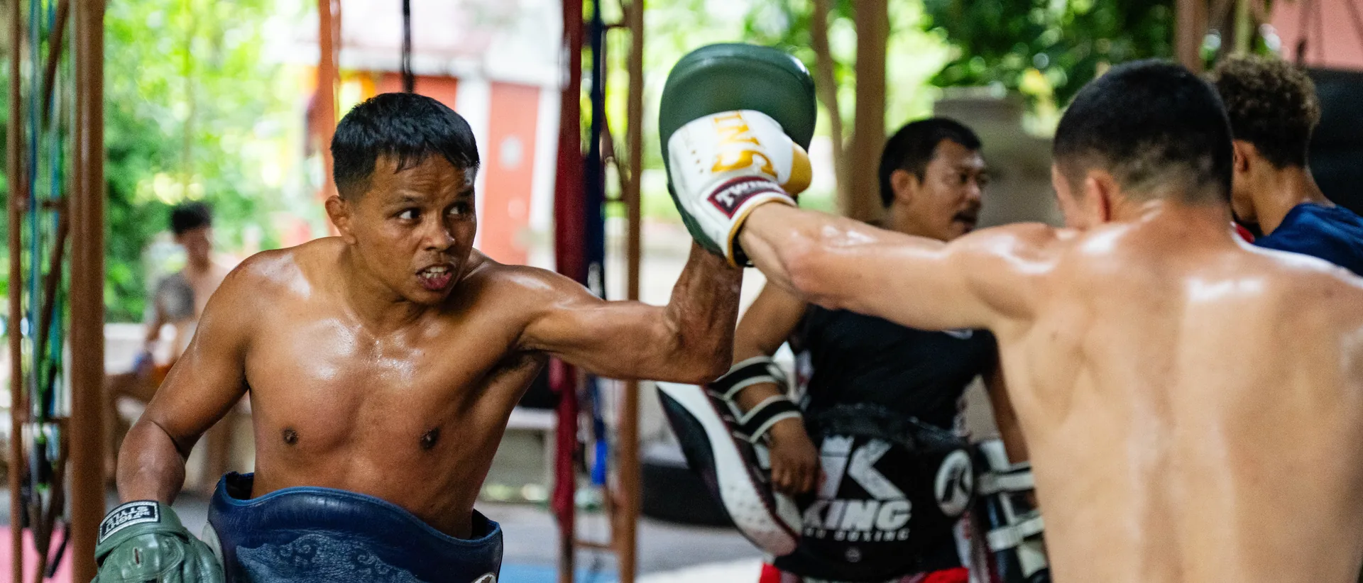 Pad rounds with a Thai kru at Kiatphontip Muay Thai gym, Bangkok